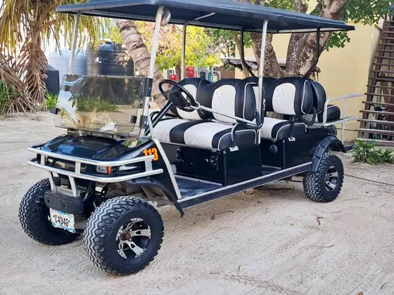 Golf cart rental beside the Caribbean sea in Ambergris Caye